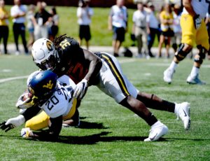 BY THE NUMBERS: WVU offense ranks last nationally in yards per carry